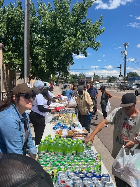 Neighbors lining up at the outreach tables