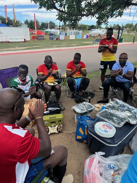 Neighbors sitting together during a Kyne Hands Foundation outreach meal