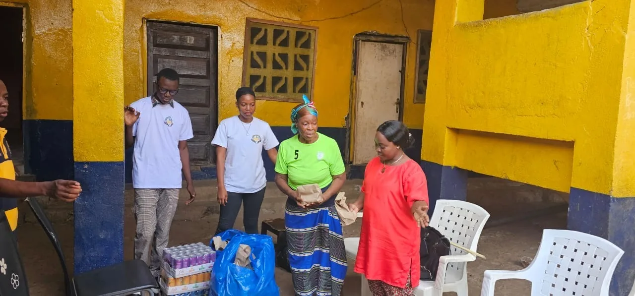 Kyne Hands Foundation volunteers and staff standing together in the orphanage courtyard