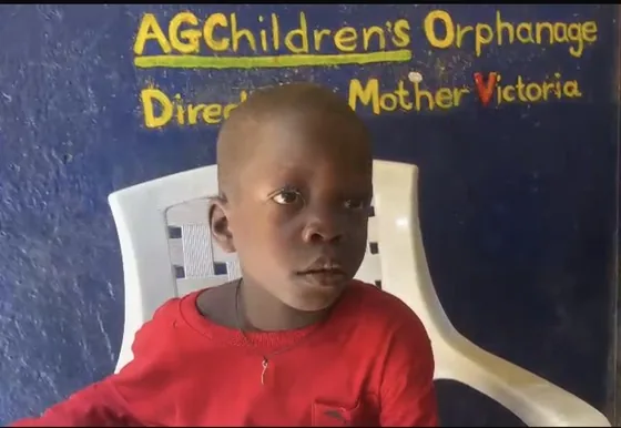 A young boy in a red shirt at the AG Children's Orphanage in Liberia
