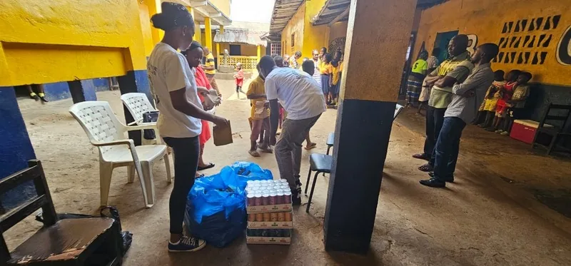 Volunteers unpacking supplies in the orphanage courtyard
