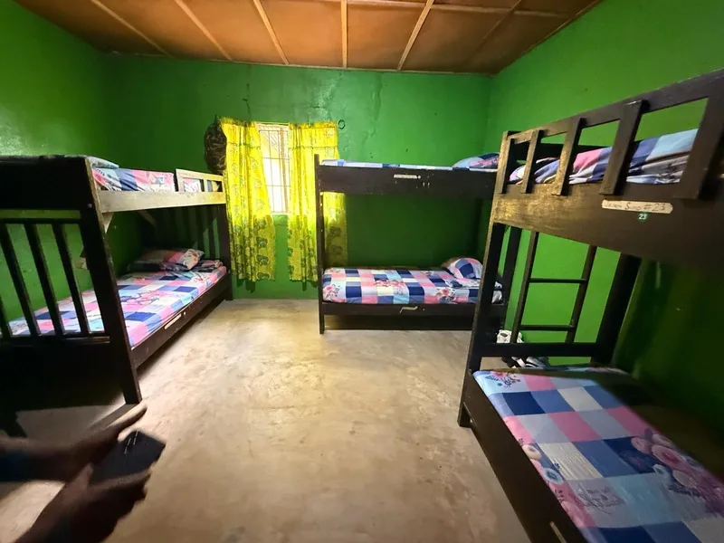 A renovated bedroom with bunk beds and new bedding
