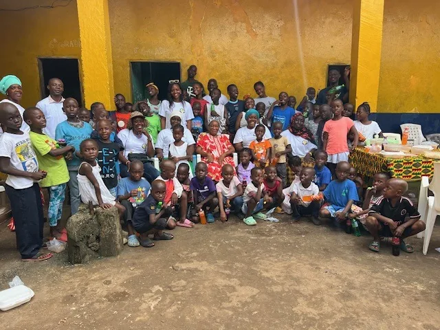 Children and volunteers gathered at the orphanage for a Kyne Hands Foundation visit